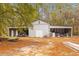 Spacious outbuilding with a metal roof, a white door, plenty of storage, and a large yard at 7537 Parkers Ferry Rd, Adams Run, SC 29426