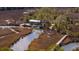 Charming house with dock nestled in a marshland setting, surrounded by lush trees and waterways at 775 Forrest Dr, Charleston, SC 29492