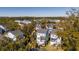 Aerial view of coastal community featuring charming homes, lush greenery, and serene waterways at 775 Forrest Dr, Charleston, SC 29492