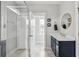 A bright bathroom with a glass enclosed shower features matching fixtures and a framed mirror at 775 Forrest Dr, Charleston, SC 29492