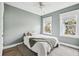 Airy bedroom with windows, simple decor, and plush bedding for a serene retreat at 775 Forrest Dr, Charleston, SC 29492