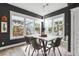 Dining room area with modern light fixture, decorative dining table and outdoor views at 775 Forrest Dr, Charleston, SC 29492