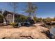 Exterior view of community screened-in recreational area on the water with palm trees at 775 Forrest Dr, Charleston, SC 29492