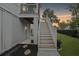 Back of the house features stairs leading to the screened porch, and a lush back yard at 775 Forrest Dr, Charleston, SC 29492