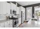 Kitchen featuring white cabinets, granite countertops, subway tile backsplash, and stainless steel appliances at 775 Forrest Dr, Charleston, SC 29492
