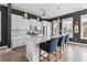 Kitchen featuring white cabinets, stainless appliances, and a large island with seating for three at 775 Forrest Dr, Charleston, SC 29492