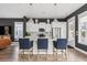 Open kitchen design with white cabinets, stainless appliances, large island with seating and pendant lighting at 775 Forrest Dr, Charleston, SC 29492