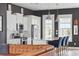 Bright and modern kitchen with stainless steel appliances, white cabinets and adjacent island seating at 775 Forrest Dr, Charleston, SC 29492