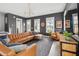 Inviting living room featuring a large sectional, stylish rug, and abundant natural light from large windows at 775 Forrest Dr, Charleston, SC 29492