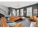 Spacious living room with a large leather sofa, stylish decor, and plenty of natural light at 775 Forrest Dr, Charleston, SC 29492