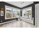 Sun-filled living room with large windows, a cozy window seat, and stylish decor at 775 Forrest Dr, Charleston, SC 29492