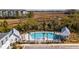 Community pool with palm trees, lounge chairs, and nearby parking at 775 Forrest Dr, Charleston, SC 29492