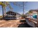 Community screened-in recreational area with picnic tables, ping pong, and kayak racks at 775 Forrest Dr, Charleston, SC 29492