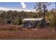 Charming screened porch with scenic views of the surrounding marsh and natural landscape at 775 Forrest Dr, Charleston, SC 29492