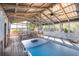 Community screened-in recreational area with picnic tables and ping pong table at 775 Forrest Dr, Charleston, SC 29492