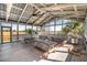 Community screened-in recreational area with picnic tables and a barbeque at 775 Forrest Dr, Charleston, SC 29492