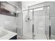 Modern bathroom featuring a glass shower stall with shower head and white subway tiles at 775 Forrest Dr, Charleston, SC 29492