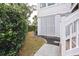 Cozy side yard with manicured landscaping, offering privacy and charm at 775 Forrest Dr, Charleston, SC 29492