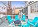 Backyard deck featuring blue Adirondack chairs and a firepit overlooking neighboring houses and water at 783 Lake Frances Dr, Charleston, SC 29412