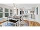 This bright dining room features lots of natural light and an open floor plan to the kitchen at 783 Lake Frances Dr, Charleston, SC 29412