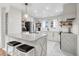 Bright, modern kitchen features white cabinetry, stainless steel appliances, and a center island at 783 Lake Frances Dr, Charleston, SC 29412