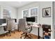 Bright home office with two desk spaces, hardwood floors, multiple windows, and comfortable office chairs at 783 Lake Frances Dr, Charleston, SC 29412