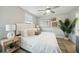 Bright bedroom includes ceiling fan, large window and neutral decor at 826 Alma Square Dr, Moncks Corner, SC 29461