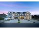 View of newly constructed townhomes boasting craftsman-style architecture and well-manicured lawns at 826 Alma Square Dr, Moncks Corner, SC 29461