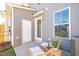 Back patio featuring outdoor seating, neutral siding, and water heater at 826 Alma Square Dr, Moncks Corner, SC 29461