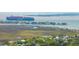 Expansive aerial view of a coastal community, featuring waterway, lush marshlands, and scenic views at 916 Kincade Dr, Mount Pleasant, SC 29464