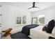 Serene bedroom with large windows, a comfortable bed, and modern ceiling fan at 916 Kincade Dr, Mount Pleasant, SC 29464
