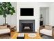 Modern fireplace with stone surround and decorative fireballs at 916 Kincade Dr, Mount Pleasant, SC 29464
