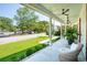 Inviting front porch with comfortable seating, a ceiling fan, and a view of the green front yard at 916 Kincade Dr, Mount Pleasant, SC 29464