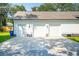 Three-car garage with ample parking space and a well-maintained exterior at 916 Kincade Dr, Mount Pleasant, SC 29464