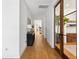 Hallway featuring hardwood floors, stylish lighting, and views into the main living areas at 916 Kincade Dr, Mount Pleasant, SC 29464