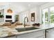 Bright kitchen with marble island, stainless steel sink, and modern lighting at 916 Kincade Dr, Mount Pleasant, SC 29464