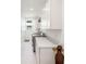 Bright laundry room with stainless steel washer and dryer and white cabinets at 916 Kincade Dr, Mount Pleasant, SC 29464