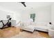 Cozy living room featuring a modern sectional sofa and hardwood floors at 916 Kincade Dr, Mount Pleasant, SC 29464