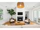 Bright living room featuring a fireplace, modern lighting, and inviting decor at 916 Kincade Dr, Mount Pleasant, SC 29464