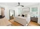Serene main bedroom with a king-size bed, hardwood floors, and ample natural light at 916 Kincade Dr, Mount Pleasant, SC 29464