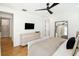 Comfortable main bedroom features hardwood floors, ceiling fan and a modern mirror at 916 Kincade Dr, Mount Pleasant, SC 29464
