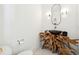 Unique powder room featuring a live edge vanity with a stone sink and modern fixtures at 916 Kincade Dr, Mount Pleasant, SC 29464