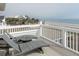 View from balcony of the sand, ocean, and surrounding neighborhood at 10 Toms Turnaround Cir, Edisto Island, SC 29438