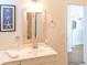 Well-lit bathroom showcasing a vanity with a mirror, offering a fresh and inviting space at 10 Toms Turnaround Cir, Edisto Island, SC 29438