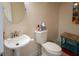 This bathroom includes a pedestal sink, and toilet at 10 Toms Turnaround Cir, Edisto Island, SC 29438