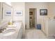 Bathroom featuring double sinks, walk-in tub, and access to the water closet at 10 Toms Turnaround Cir, Edisto Island, SC 29438