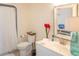 Well-lit bathroom featuring a vanity, toilet, and shower with a curtain creating a fresh space at 10 Toms Turnaround Cir, Edisto Island, SC 29438