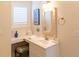 Bright and tidy bathroom with a vanity area, featuring a makeup table and ample natural light at 10 Toms Turnaround Cir, Edisto Island, SC 29438