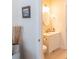 Bright bathroom with white vanity, tiled flooring, and decorative accents providing a cozy feel at 10 Toms Turnaround Cir, Edisto Island, SC 29438