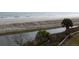 Beach view with a sandy beach, ocean, and stream of water at 10 Toms Turnaround Cir, Edisto Island, SC 29438